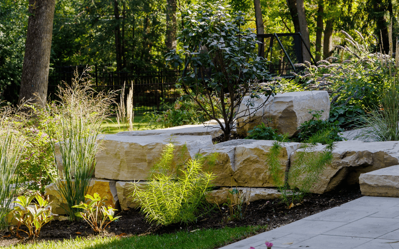Natural stone retaining wall with plantings